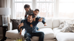 Dad playing with his sons at home