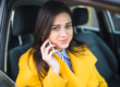 lady sitting in a taxi while on the phone